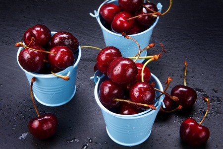 Cherry basket - delicious red sweet fruit cherriesの写真素材