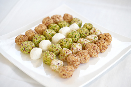 Delicious pralines in a white dish