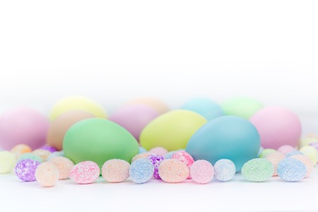 Colorful Assorted sizes Pastel Easter Eggs sunny background with copy spaceの写真素材