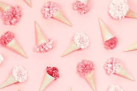 Spring summer waffles cones with flowers pattern candy pink monochromatic backgroundの写真素材