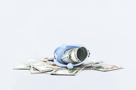 Open coins purse with hundred dollars notes on blue. Finance markets investments loans earnings concept. Personal accounting debts and credits or savings. bankruptcy with copy spaceの写真素材