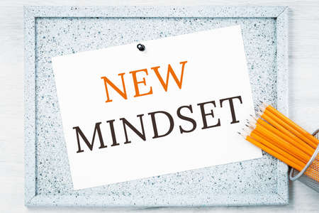 New mindset text on grey cork notice board with pencils. Flexible and innovative work approach. Success management conceptの写真素材