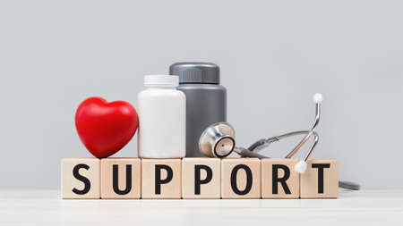 Medical support text with stethoscope red heart and pills or tablets jars. Health care and social...