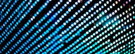 Colorful background with natural bokeh texture and defocused sparkling lights pattern. Teal and orange blur background with twinkling lights. Festive multi-colored overlay colors bannerの写真素材