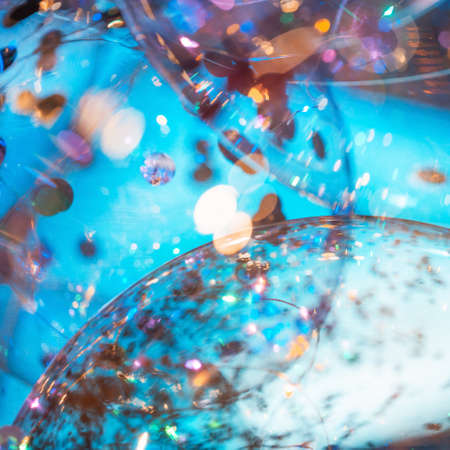 Blue balloons with natural bokeh texture and defocused sparkling lights. Teal and orange blur...