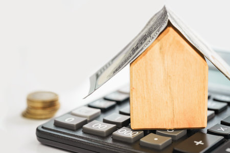 House with money and calculator. real estate mortgage rent sale or insuranceの写真素材