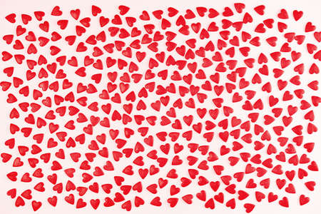 Heart shaped red sprinkles pattern background banner, festive love gift and Valentine's Day concept....