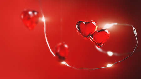 Two glass hearts pendants. big and small. St Valentines Day greeting card banner or Mother's Day....