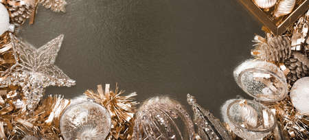 Merry Christmas and Happy New Year rich golden and crystal festive ornaments baubles tinsel stars and copy space. Party decor. border. Monochrome banner. Top viewの写真素材