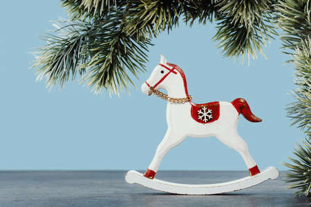 Christmas ornaments rocking horse on blue backgroundの写真素材
