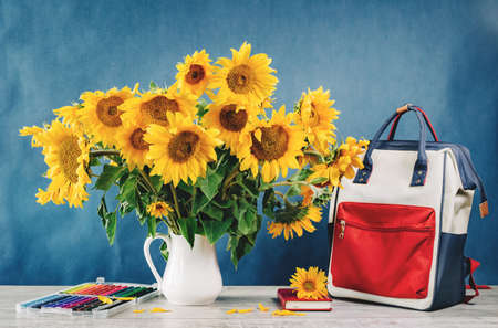 Sunflowers bouquet in a floral arrangementon a tableの写真素材