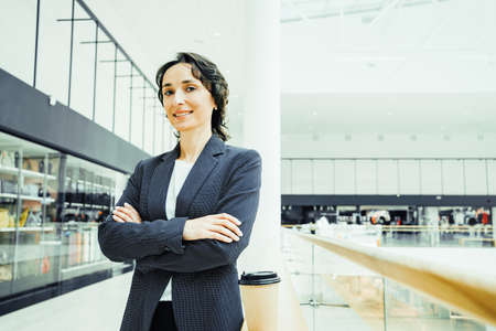 Portrait. Successful confident smiling middle-aged caucasian business woman looks into camera...