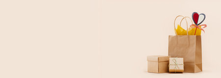 Fall Gift or Sale concept. Shopping paper bag, with gift boxes mockup red felt heart Valentines day tag. Copy space. Thanksgiving. Packaging. Box order delivery. Thank youの写真素材