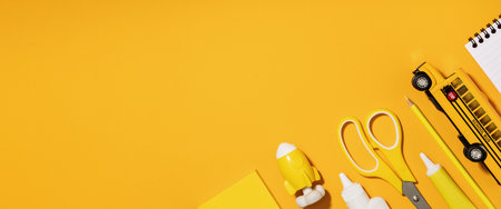 Assorted office and school white and yellow stationery. copy space for back to school or education craft office work concept. Bright Yellow monochrome school bus, rocket. Achievement and success.の写真素材