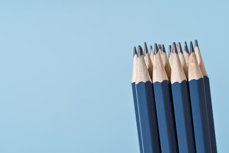 Bundle of blue Pencils on blue. Back to School or drawing and creativity concept. Office supply. Copy space. Side view close upの写真素材