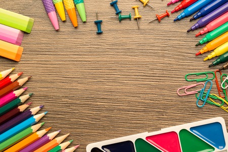 View from above, bright school accessories, stationery on a wooden background.の写真素材