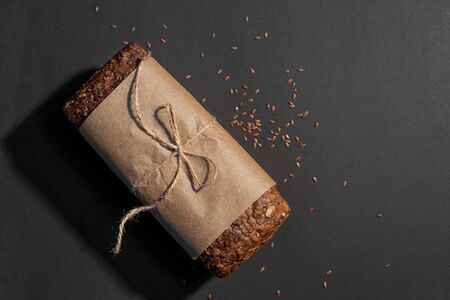 Top view of sliced wholegrain bread on dark background, copy spaceの写真素材