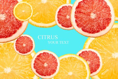 Creative layout of lemon and grapefruit on the blue background. Flat lay, Citrus concept, copy spaceの写真素材