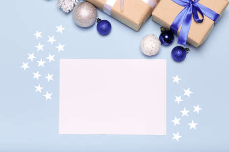 Empty christmas card on blue, Christmas blue background with decorations, gift box and balls.の写真素材