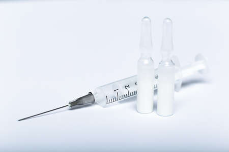 Syringes, ampoules injection on white background, medicine injection close-up.の写真素材