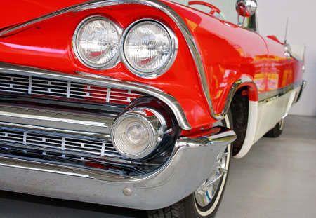 front side view of red and white classic carの写真素材