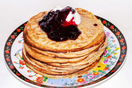 Pancakes with sour cream and berry jam