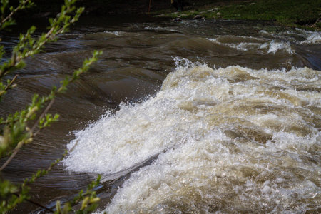 Strong river current, splash of water, close-up waves. Natural background.