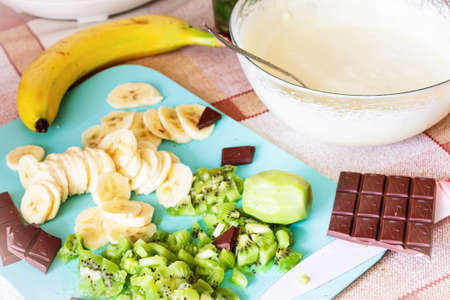 Very tasty whipped cream for the cake close-up.Nearby are fruit and chocolate.の写真素材