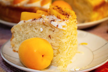 Very delicate pie with apricots for tea close-up. Homemade pastries.の写真素材