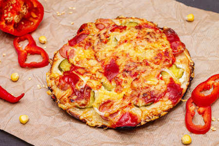 Delicious pizza with sausages, pepper and cheese close-up.の写真素材