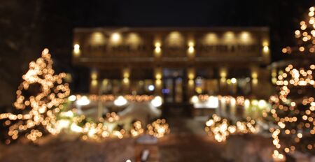 Christmas tree with lights glowing and snowの写真素材