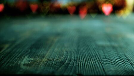 Valentines day concept with heart bokeh on blue wooden background