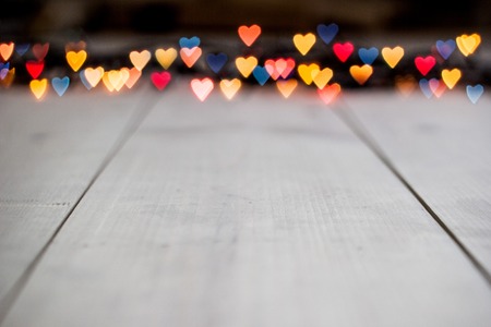 variegated heart bokeh, Valentine's day concept on wooden backgroundの写真素材