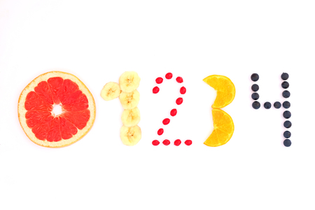numbers from zero to four made of fruit and berries on white backgroundの写真素材