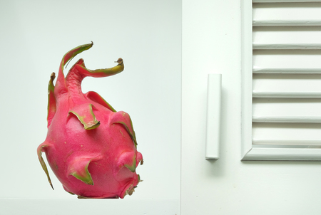 dragon fruits close-up in a white cupboardの写真素材