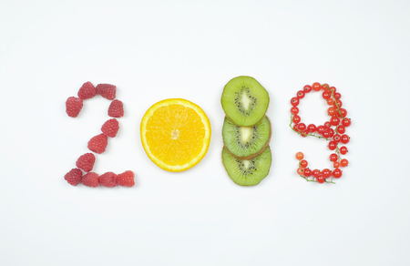 happy new year 2019 of fruit and berries on the white background.の写真素材