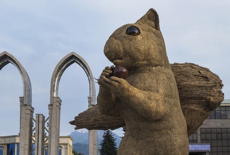 Almaty, Kazakhstan - July 15, 2018: The huge squirrel made of hay in Atakent square.のeditorial素材