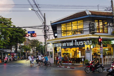 BANGKOK, THAILAND - February 01, 2019 - beautiful cafe and people, cars in the street in the eveningのeditorial素材