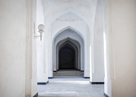 White Arabian arches in Kalyan Mosque that was built 16th-century. Bukhara, Uzbekistan. Central Asia.の写真素材