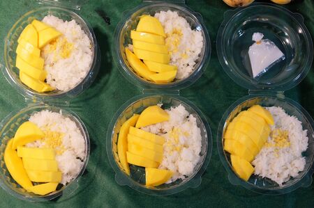 Traditional thai dessert, sticky rice with mango.の写真素材