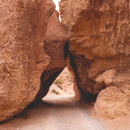 Natural arch made of large stones in Charyn canyon near Almaty city, Kazakhstan.の写真素材