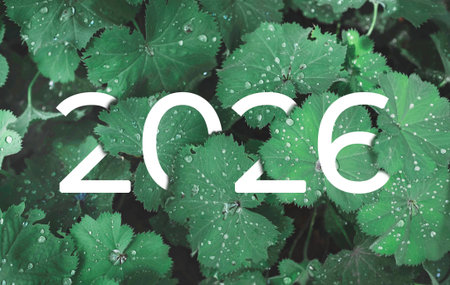 2026 New year white text hidden in natural green leavesの写真素材