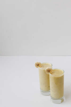 banana smoothie on a white backgroundの写真素材
