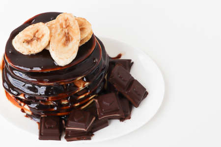 pancakes with chocolate on a white background