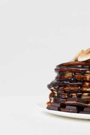 pancakes with chocolate on a white backgroundの写真素材