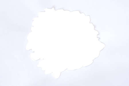 Hole ripped in white paperの写真素材