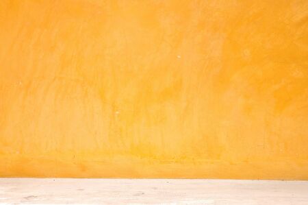 Yellow grunge wall with street, textured backgroundの写真素材