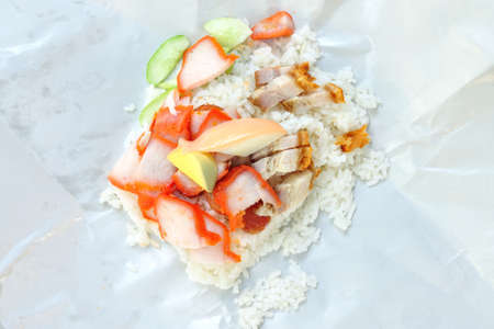 Khao Moo Daeng  rice with roasted red pork  on paper packed, Popular Thai food の写真素材