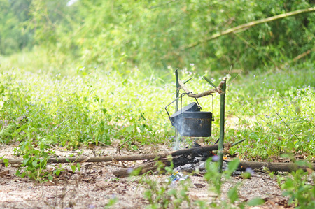 Cooking pot in campfire, Camping in forestの写真素材