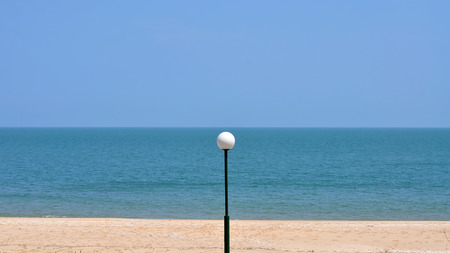 Light pole on the beach with blue sky, abstract backgroundの写真素材